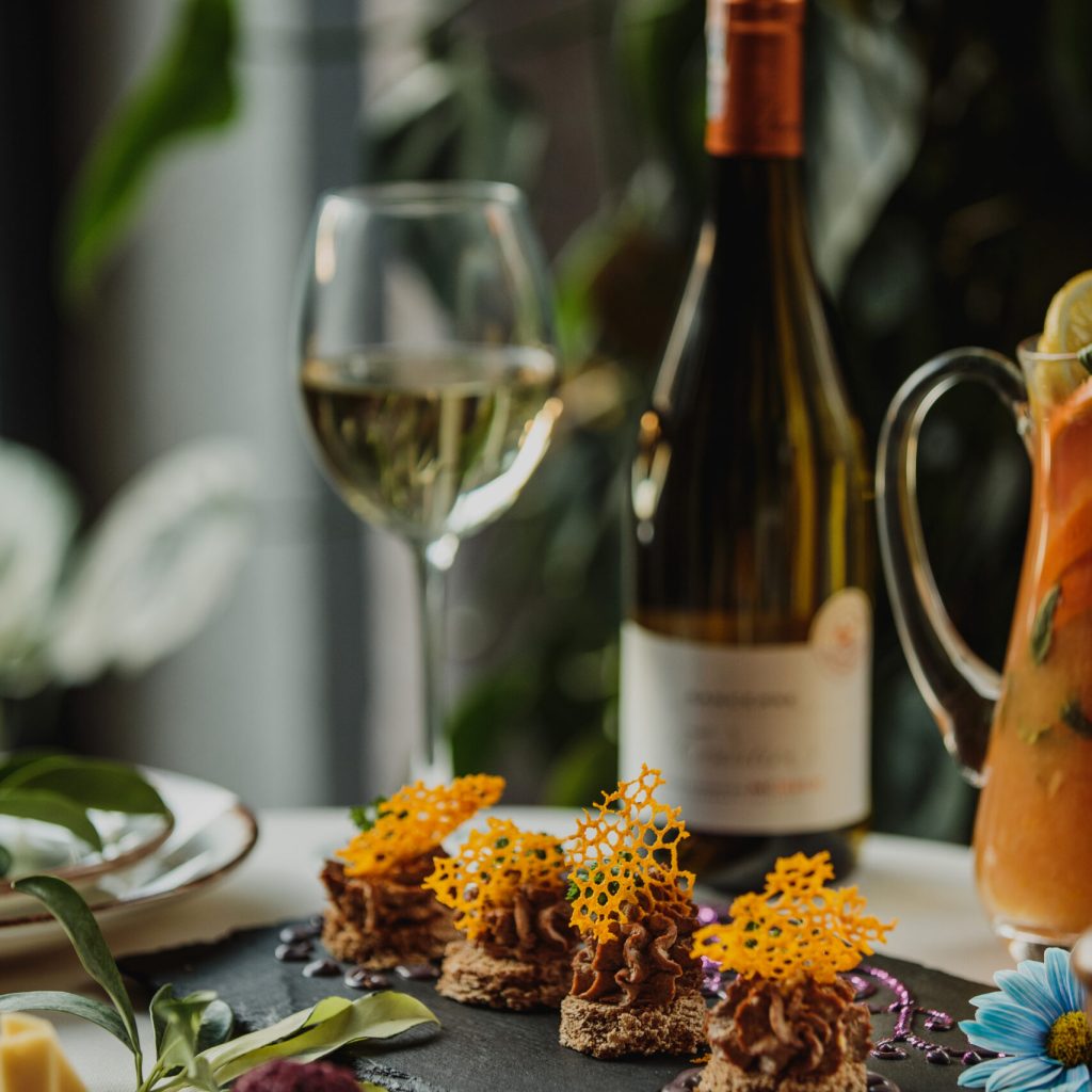 side view of chicken liver pate on a black board on the table